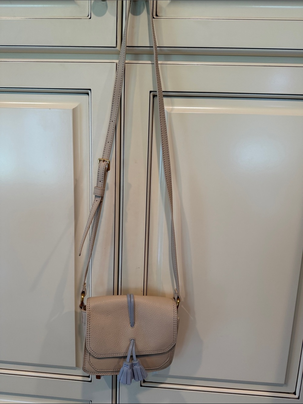 HOBO Pebbled Leather Crossbody in Light Taupe with Lavender Tassel
